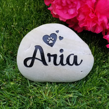 Load image into Gallery viewer, pet memorial stone. Personalized with a name, paw print and hearts. Natural river rock garden memorial or pet gravestone